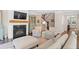 Cozy living room with fireplace, stylish furniture, and staircase access for relaxed living at 127 Marlow Dr, Woodstock, GA 30188