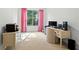 Bright office features a desk, cabinets, and a window with pink curtains at 127 Marlow Dr, Woodstock, GA 30188
