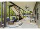Covered patio with outdoor seating, ceiling fans, and views of the backyard at 127 Marlow Dr, Woodstock, GA 30188
