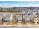 Beautiful aerial view of a neighborhood near a lake and wooded area, showcases well-maintained homes at 137 Centennial Ridge Dr, Acworth, GA 30102
