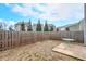 Backyard features a concrete patio, lawn, and wooden fence, perfect for outdoor relaxation and privacy at 137 Centennial Ridge Dr, Acworth, GA 30102