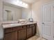 Bathroom features double sinks with framed mirror, a towel display, and a white door at 137 Centennial Ridge Dr, Acworth, GA 30102
