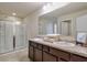 Bathroom with double sinks, a large mirror, and a glass-enclosed shower at 137 Centennial Ridge Dr, Acworth, GA 30102