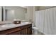Bathroom with double sinks, vanity and shower with a white shower curtain at 137 Centennial Ridge Dr, Acworth, GA 30102