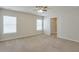 Bedroom featuring neutral carpet, a ceiling fan, and multiple windows for natural light at 137 Centennial Ridge Dr, Acworth, GA 30102
