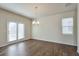 Open dining area with hardwood floors, natural light, and stylish lighting fixture at 137 Centennial Ridge Dr, Acworth, GA 30102