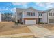 Lovely home featuring attached garage, brick accents, neutral siding, and well-maintained landscaping at 137 Centennial Ridge Dr, Acworth, GA 30102