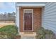 Close-up of the front door with brick surround and welcoming landscaping at 137 Centennial Ridge Dr, Acworth, GA 30102