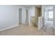 Hallway featuring neutral-colored carpet, white trim, and access to multiple rooms at 137 Centennial Ridge Dr, Acworth, GA 30102