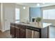 Modern kitchen island features granite counters, a stainless steel dishwasher, and a double sink at 137 Centennial Ridge Dr, Acworth, GA 30102