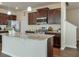 Well-equipped kitchen features granite counters, stainless steel appliances, and dark wood cabinets at 137 Centennial Ridge Dr, Acworth, GA 30102