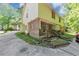 Townhouse with wooden back porch featuring brick siding and a private driveway at 1432 Forest Villa Dr, Conyers, GA 30012