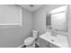 Cozy bathroom with a gray vanity and a window to provide natural light at 1432 Forest Villa Dr, Conyers, GA 30012