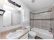 Bathroom with marble-look tile around the shower and newer sink and fixtures at 1432 Forest Villa Dr, Conyers, GA 30012