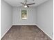 Spacious bedroom features neutral carpet and a large window for natural light at 1432 Forest Villa Dr, Conyers, GA 30012
