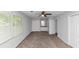 Neutral Primary bedroom features closet and ensuite bathroom, plus ceiling fan and window at 1432 Forest Villa Dr, Conyers, GA 30012