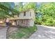 Two-story townhouse featuring brick and vinyl siding and private driveway at 1432 Forest Villa Dr, Conyers, GA 30012
