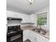 Efficient kitchen featuring white cabinets, ample counter space, and modern appliances at 1432 Forest Villa Dr, Conyers, GA 30012