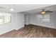 Bright living room with hardwood floors, recessed lights, and a ceiling fan at 1432 Forest Villa Dr, Conyers, GA 30012