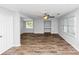 Spacious living room with hardwood flooring, a ceiling fan, and lots of natural light at 1432 Forest Villa Dr, Conyers, GA 30012