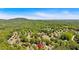 Stunning aerial view of a home nestled in a lush, green landscape with mountain views at 3921 Upland Way, Marietta, GA 30066