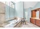 Bright bathroom with a soaking tub, tiled shower, and double vanity at 3921 Upland Way, Marietta, GA 30066