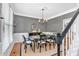 Elegant dining room featuring neutral tones, hardwood floors, and stylish chandelier at 3921 Upland Way, Marietta, GA 30066