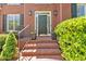 Inviting front entrance with brick steps, decorative plants, and stylish lighting fixtures at 3921 Upland Way, Marietta, GA 30066