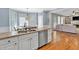 Bright kitchen with view to breakfast area. Features stainless appliances, granite and hardwood at 3921 Upland Way, Marietta, GA 30066