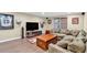 Spacious den with wood-look flooring, recessed lighting, and comfortable seating at 3921 Upland Way, Marietta, GA 30066