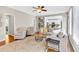 Cozy living room with hardwood floors, ceiling fan, and an abundance of natural light at 3921 Upland Way, Marietta, GA 30066