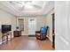 Comfortable living room featuring wood-look flooring, recessed lighting, and a tray ceiling at 3921 Upland Way, Marietta, GA 30066