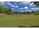 Beautiful baseball field featuring well-maintained grass and clear blue skies at 4750 Spring Wood Trce, Cumming, GA 30041