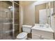 Neutral bathroom featuring a glass-enclosed shower, white vanity, and tiled walls at 4750 Spring Wood Trce, Cumming, GA 30041