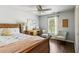 Comfortable bedroom with hardwood floors, and a window bringing in natural light at 4750 Spring Wood Trce, Cumming, GA 30041