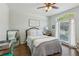 Bright bedroom with large window, light walls, and decorative accents creating a peaceful retreat at 4750 Spring Wood Trce, Cumming, GA 30041