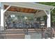 Stylish clubhouse featuring wood ceilings, ceiling fans, and outdoor seating, perfect for relaxation at 4750 Spring Wood Trce, Cumming, GA 30041