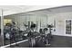 Well-equipped fitness center with modern exercise machines and mirrored walls to help reach goals at 4750 Spring Wood Trce, Cumming, GA 30041