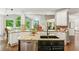 Spacious kitchen features granite countertops, a center island, and stainless steel appliances at 4750 Spring Wood Trce, Cumming, GA 30041