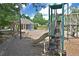 A community playground with slides, jungle gym and other playground equipment for recreation at 4750 Spring Wood Trce, Cumming, GA 30041