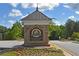 Chattahoochee River Club stone sign with mature trees and landscaping for a welcoming entrance at 4750 Spring Wood Trce, Cumming, GA 30041