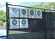 Tennis court fence displaying ALTA city champion and finalist signage from recent years at 4750 Spring Wood Trce, Cumming, GA 30041