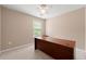 Cozy bedroom with large window and desk, perfect for an office or study at 550 Bayswater Way, Suwanee, GA 30024