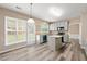 Sun-filled eat-in kitchen boasts stainless appliances and island at 550 Bayswater Way, Suwanee, GA 30024