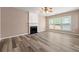 Cozy living room has a fireplace and plenty of natural light at 550 Bayswater Way, Suwanee, GA 30024