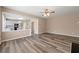 Open-concept living room leads to the kitchen at 550 Bayswater Way, Suwanee, GA 30024