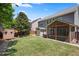 Backyard features a well-maintained lawn, outdoor storage shed, and screened in patio at 3883 Wakefield Hall Se Sq, Smyrna, GA 30080