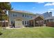 Spacious backyard featuring a well-maintained lawn, screened in patio, and storage shed at 3883 Wakefield Hall Se Sq, Smyrna, GA 30080