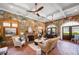 Spacious clubhouse with stone walls, brick floors, fireplace, comfortable seating, ceiling fans, and an elegant decor at 3883 Wakefield Hall Se Sq, Smyrna, GA 30080