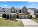 Beautiful two-story home with a manicured lawn, a two-car garage and inviting front yard landscaping at 3883 Wakefield Hall Se Sq, Smyrna, GA 30080